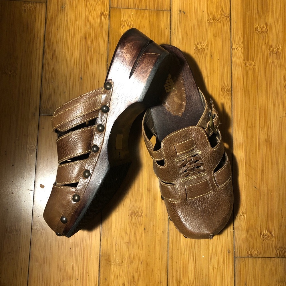 Nomi brown wood strappy leather clogs with studded details
